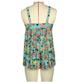 Woman wearing Aqua Floral Print Tankini, a lightweight sleeveless summer top with a round neck and fitted waist, in electric blue color with floral patterns.