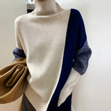 Asymmetric two-tone turtleneck sweater in blue and grey, featuring ribbed cuffs and a unique design suitable for one size fits all.
