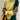 Asymmetric two-tone turtleneck sweater in green, featuring ribbed cuffs and a unique design that highlights the neck and shoulder area. The sweater is showcased on a mannequin, emphasizing its fashion-forward style and comfortable fit suitable for various body types.