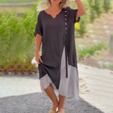 Asymmetrical blue V-neck maxi dress featuring side buttons, showcasing a stylish summer fashion look. The dress highlights the shoulder and waist areas, with a focus on the sleeve and neck design.