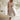 Asymmetrical blue V-neck maxi dress featuring side buttons, displayed on a mannequin showing the shoulder, sleeve, and waist details. The dress is styled for summer fashion and is available in size 4XL in a beige variant.