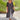 Asymmetrical blue V-neck maxi dress featuring side buttons, designed for summer fashion, with a focus on the dress's neckline, waist, and knee-length hem.