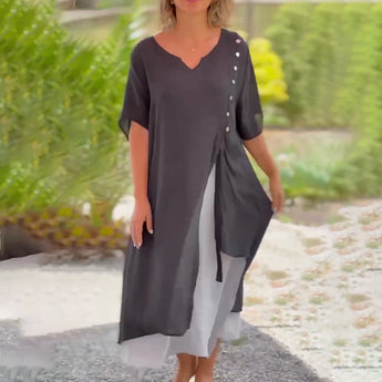 Asymmetrical blue V-neck maxi dress featuring side buttons, designed for summer fashion, with a focus on the dress's neckline, waist, and knee-length hem.