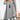 Autumn fashion V-neck black plaid tunic dress with button detail, featuring long sleeves and a comfortable fit, displayed in a stylish pose against a neutral background.