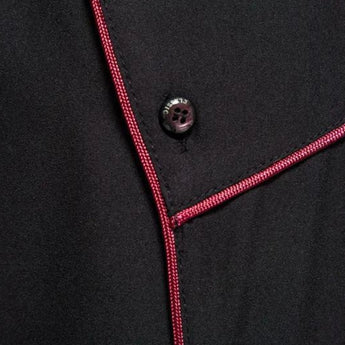 A stylish men's black asymmetric slim fit shirt featuring a unique design with an asymmetric cut and a modern collar, highlighting its contemporary avant-garde fashion style.