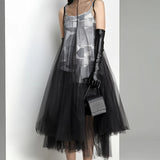 Avant-garde black plaid tulle midi dress featuring a unique fashion design with a knee-length cut, long sleeves, and a fitted waist for an edgy and stylish look.