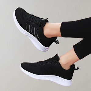 Black lightweight running shoes for women, designed for breathability and comfort.