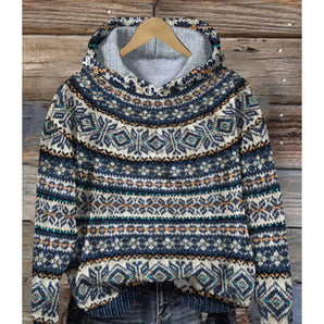 Aztec Pattern Cowl Neck Hoodie in blue, featuring a warm winter tribal design, displayed on a clothes hanger. The hoodie has long sleeves and a cowl neck, with a prominent Aztec pattern in shades of grey and blue. The garment is size 3XL.