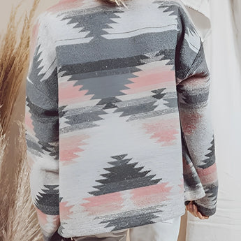 Aztec pattern southwestern print sweater in a bohemian knit pullover style, featuring grey and pink colors with long sleeves and a classic round neckline.
