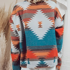 Aztec Pattern Southwestern Print Sweater - Bohemian Knit Pullover featuring intricate geometric designs, modeled by a person with long hair, showcasing the shoulder and arm areas, with the focus on the textured knit fabric and long sleeves.