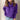
Woman wearing a purple balloon sleeve turtleneck sweater paired with jeans.