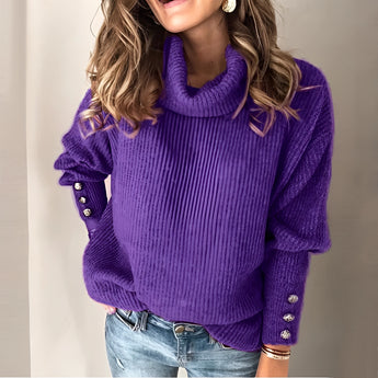 
Woman wearing a purple balloon sleeve turtleneck sweater paired with jeans.