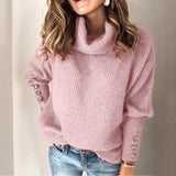
A woman wearing a rose-colored, 3XL baby blue balloon sleeve turtleneck sweater.