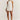 Backless white mini dress featuring a pleated skirt, pearl straps, and sleeveless design, ideal for party wear.