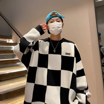 Balenciaga Men's Luxury Striped Wool Crewneck Sweater in black, size 2XL, featuring a classic crewneck design with bold stripes, worn by a model in a fashionable pose.