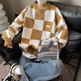 A Balenciaga Men's Luxury Striped Wool Crewneck Sweater featuring long sleeves, a classic crew neckline, and a stylish striped design in a high-fashion setting.