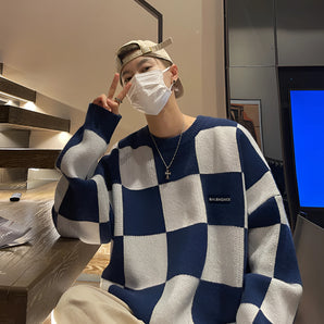 Balenciaga men's luxury striped wool crewneck sweater being worn, showcasing its design with long sleeves and a fitted waist. The focus is on the upper body, highlighting the shoulder and sleeve details.