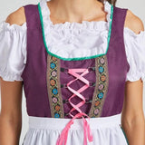 Bavarian Oktoberfest women's dirndl dress in green and purple, featuring a traditional design with white blouse, short sleeves, and a fitted bodice.