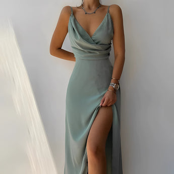 Green adjustable strap cami with a zipper, featuring a fitted design suitable for summer wear, photographed on a mannequin.