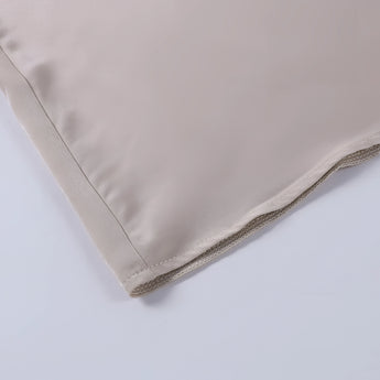 Beige adjustable strap camisole with a zipper, showcasing a sleeveless and collarless design, ideal for versatile summer fashion.