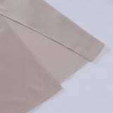 Beige adjustable strap cami with a zipper, featuring a versatile and minimalist design.