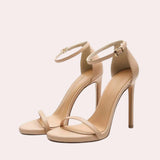 Beige ankle strap stiletto heels with an elegant platform design, showcasing high heels and sleek sandal style, ideal for formal occasions or bridal wear.