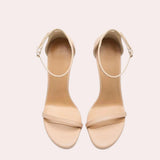 Beige ankle strap stiletto heels with platform design, featuring a sleek high heel and elegant silhouette.