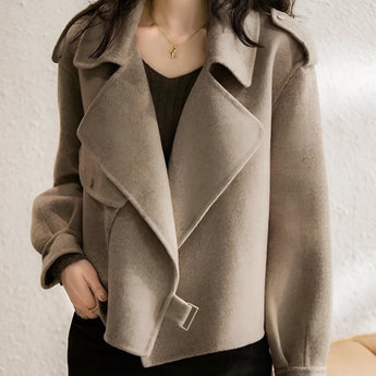Beige biker jacket made from a textured wool blend, designed for women. The jacket features a structured collar, full sleeves, and falls to the waist. It has a fashionable design suitable for fall, shown in a cachi color and size 2XL.