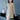 Beige cable knit dress featuring long sleeves, showcasing a fall fashion style, worn by a model. The dress is styled as a tunic and is in a 4XL size.