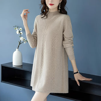 Beige cable knit dress featuring long sleeves, showcasing a fall fashion style, worn by a model. The dress is styled as a tunic and is in a 4XL size.