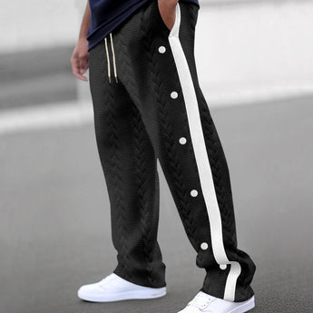 Beige chevron textured elastic waist sweatpants displayed on a model, showcasing the comfortable fit and cozy lounge style with a focus on the waistband and leg detailing.