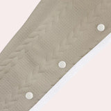 Beige chevron textured elastic waist sweatpants displayed on a wooden surface, showcasing their cozy and patterned design ideal for lounging.