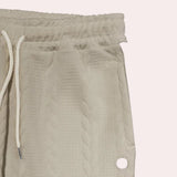 Beige chevron textured elastic waist sweatpants with a cozy and comfortable design, suitable for lounging.