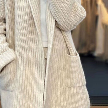 Beige chunky knit oversized women's cardigan with pockets, featuring long sleeves and a cozy, soft texture.