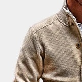 Men's beige corduroy blazer with long sleeves and a notched collar, worn over a dress shirt. The lightweight jacket is styled for fall fashion, showcasing a sophisticated and casual look.