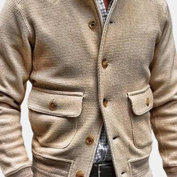 Beige corduroy men's blazer shown on a mannequin, featuring a lightweight design ideal for fall fashion, with a structured collar, long sleeves, and a tailored waist for a stylish, sophisticated look.