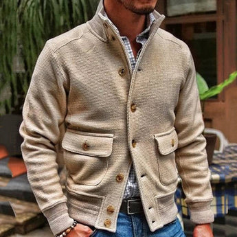 Beige corduroy men's blazer in XL size, featuring a lightweight design suitable for fall fashion. The jacket is styled with a dress shirt underneath, showcasing classic outerwear details like sleeves and a structured neck.
