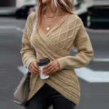 Beige crew neck sweater worn by a woman with sunglasses, featuring long sleeves and a relaxed fit suitable for casual fall fashion.