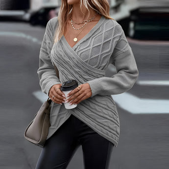 Beige crew neck sweater worn by a woman, showcasing a casual fall fashion style with long sleeves and a comfortable fit.