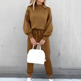 Beige crew neck t-shirt in soft cotton fabric, featuring minimalist design, displayed in XXL size with visible shoulder and sleeve details.