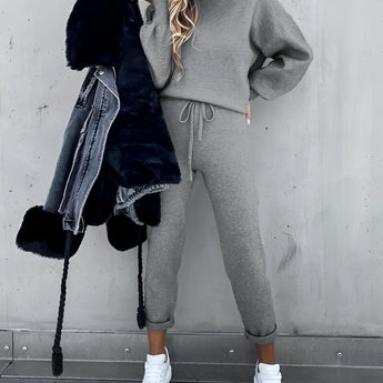 A beige crew neck t-shirt made from soft cotton, designed for minimalist everyday wear, displayed on a person.