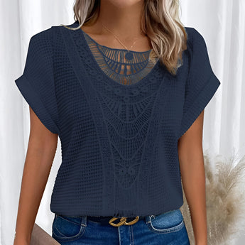 Beige crochet lace bohemian top for women featuring intricate lace detailing, with a relaxed fit suitable for summer. The blouse is styled to showcase a fashion-forward look, highlighting shoulders and neck area, available in a dark blue variant sized 5XL.