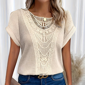 Women's summer beige crochet lace bohemian top with short sleeves and a round neckline, showcasing intricate lace detailing. This blouse is in a 5XL size, perfect for a stylish and comfortable bohemian look.