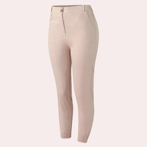 Beige slim fit ankle-length women's trousers with an elastic waist, designed for spring wear.