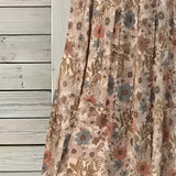 Beige floral A-line midi skirt featuring a vintage style, perfect for spring and summer wear.