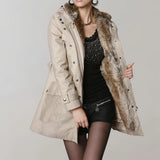 Beige fur-lined women's trench coat featuring luxurious fur collar and cuffs, with a tailored fit that accentuates the waist and extends to the knee, ideal for winter fashion.
