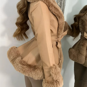 Beige fur trimmed belted jacket for women, featuring long sleeves and a stylish design suitable for winter wear. The coat showcases a luxurious fur collar and a fitted silhouette, perfect for elegant cold-weather fashion.