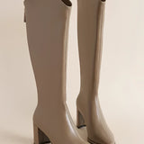Beige knee-high leather boots with block heel and side zipper, featuring a stylish and comfortable design ideal for fall fashion, shown in the shade Cachi and size 43.