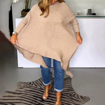 
A beige knit oversized cardigan designed for women's fall fashion, featuring long sleeves, a relaxed fit, and a cozy texture.