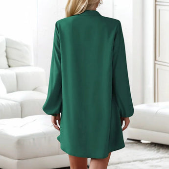 Beige lantern sleeve shirt dress with button front, featuring a casual mini length and a collared neckline.